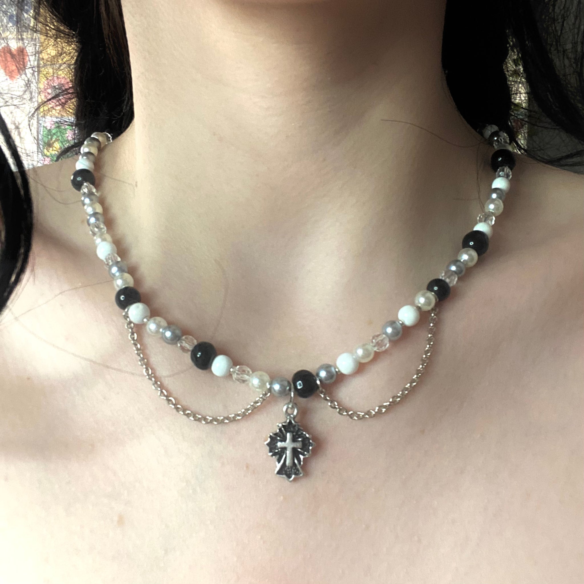 “Mary on a Cross” necklace